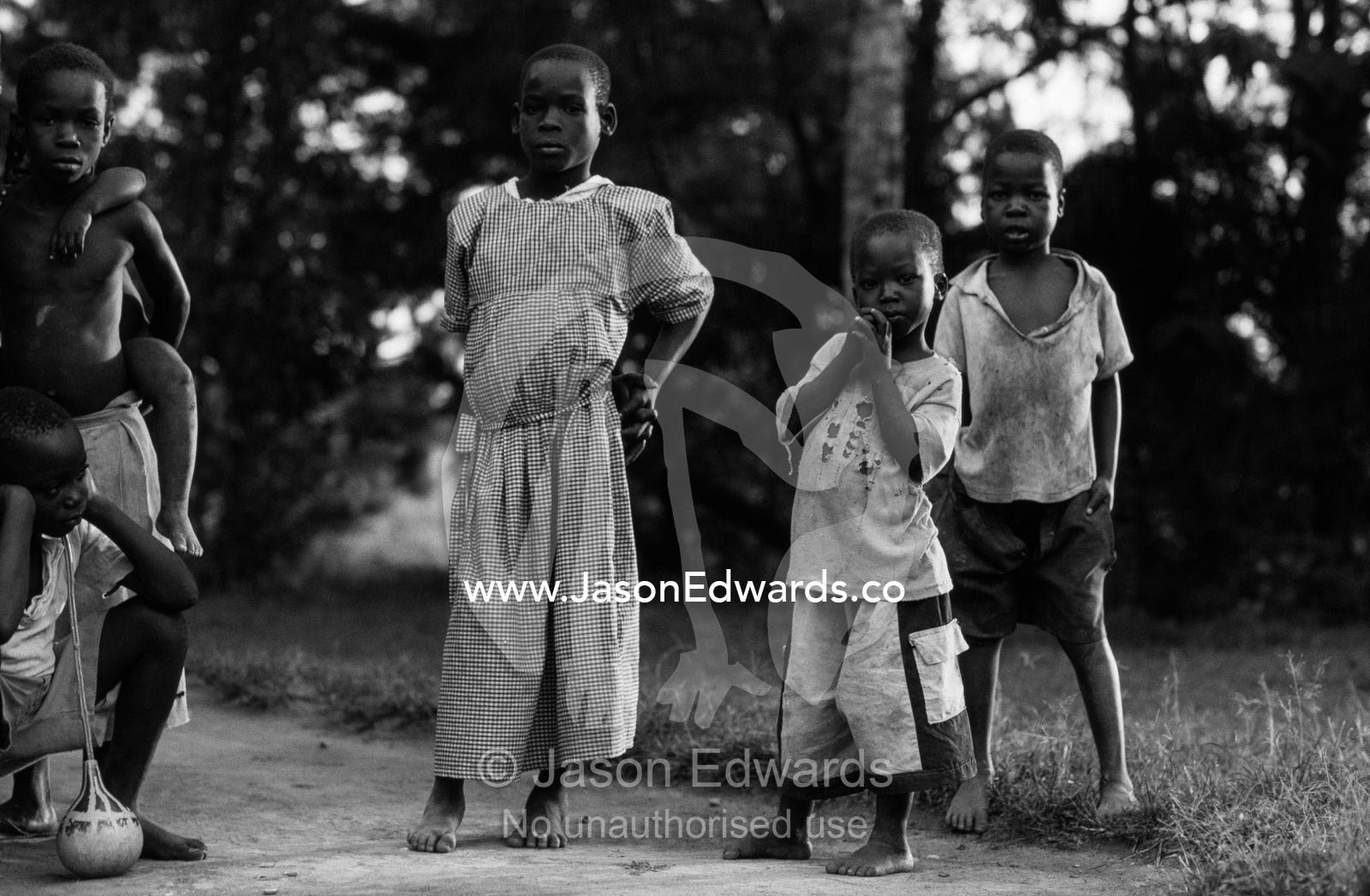 Village school children resting in the shade from the afternoon heat. Tororo District, Uganda.