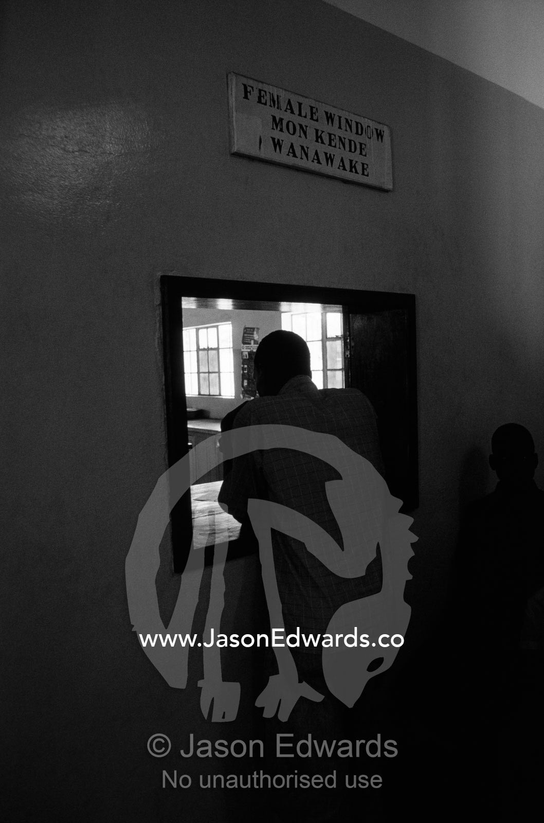 A patient waits to collect medications for the treatment of HIV AIDS. Tororo District Hospital, Uganda.