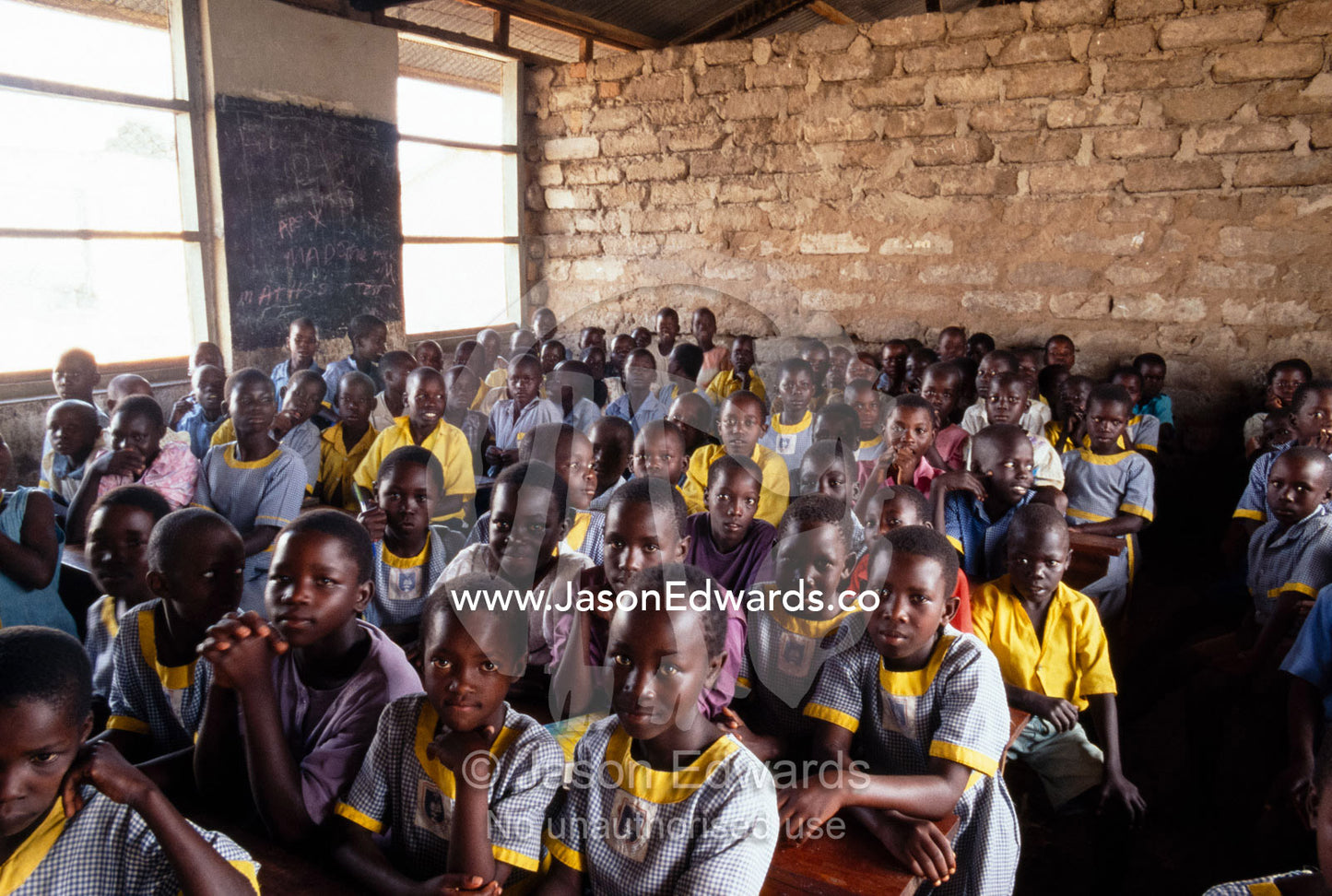 School children listen to a lesson on AIDS prevention. Tororo Prison School, Tororo District, Uganda.