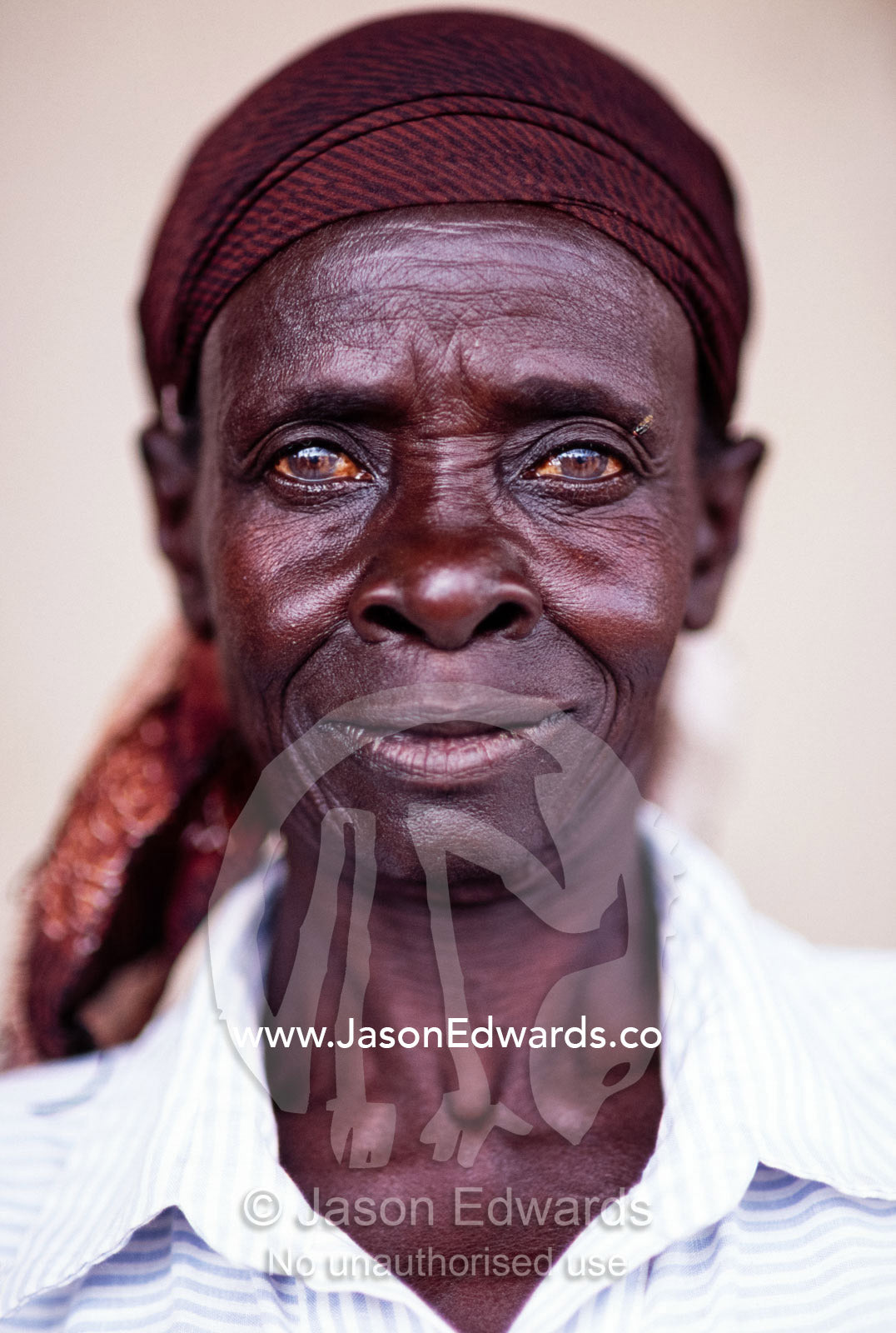 The intense stare and weathered features of an East African woman. Tororo District, Uganda.