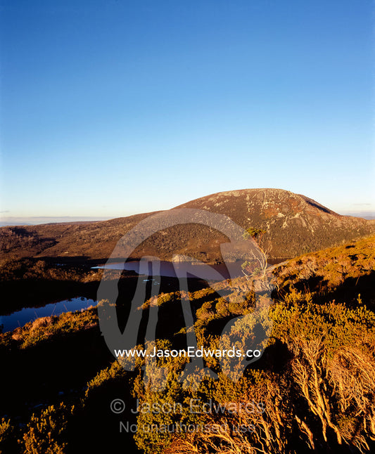 Sunset caresses the summit of Mount Campbell from Marions Lookout. Cradle Mountain, Lake St Clair National Park, Tasmania, Australia.
