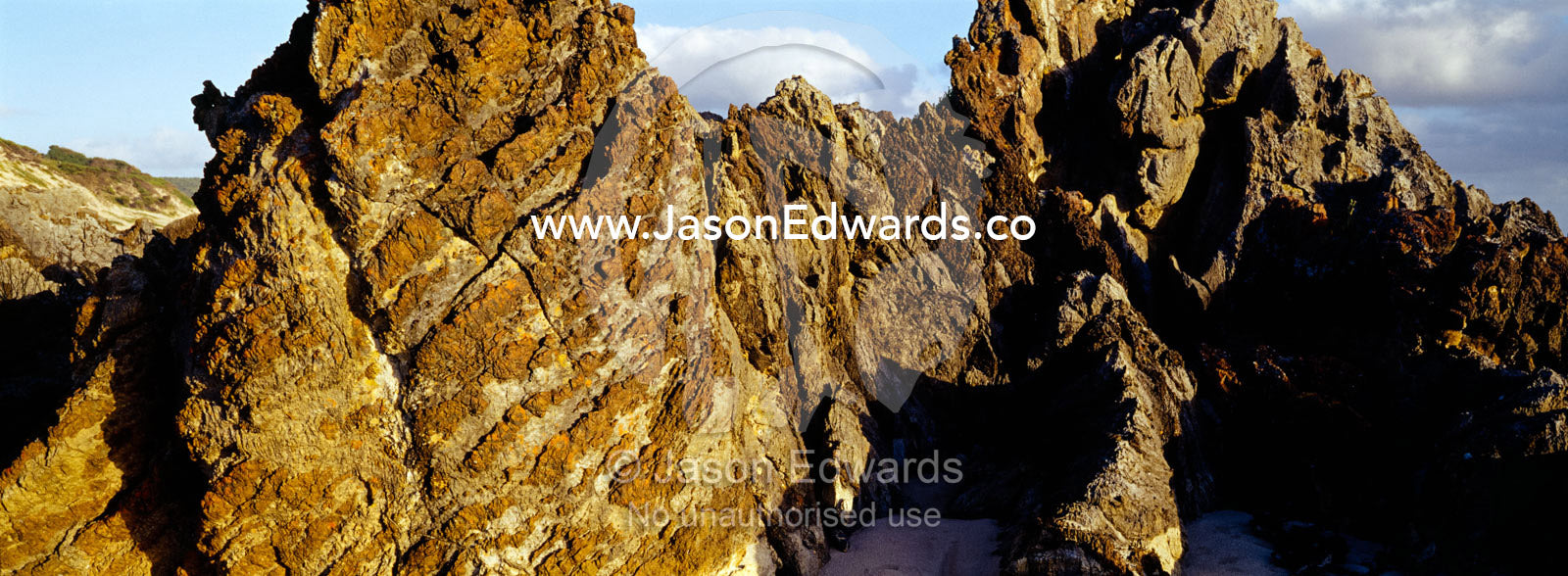 Razor sharp rocks greet the Southern Ocean where it smashes the coast. South West Conservation Area, Tasmania, Australia.