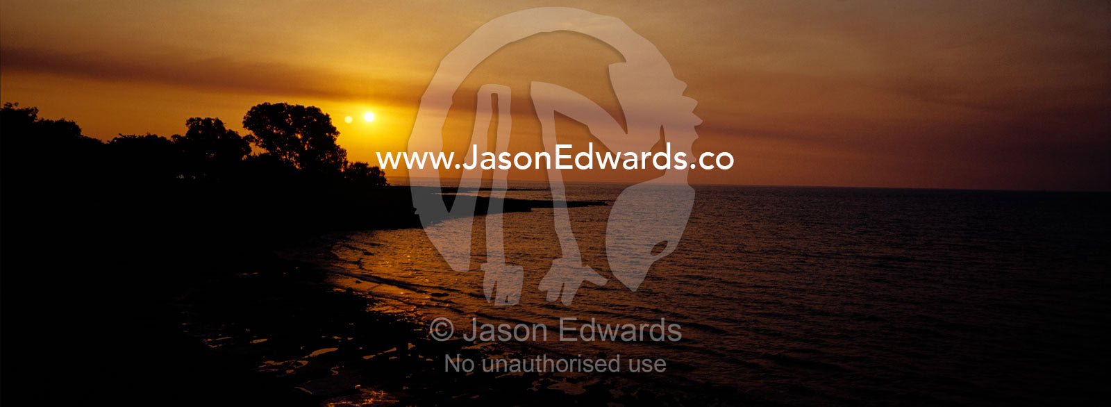 Sunset over the tranquil seas of the Beagle Gulf in Northern Australia Darwin, Northern Territory, Australia.