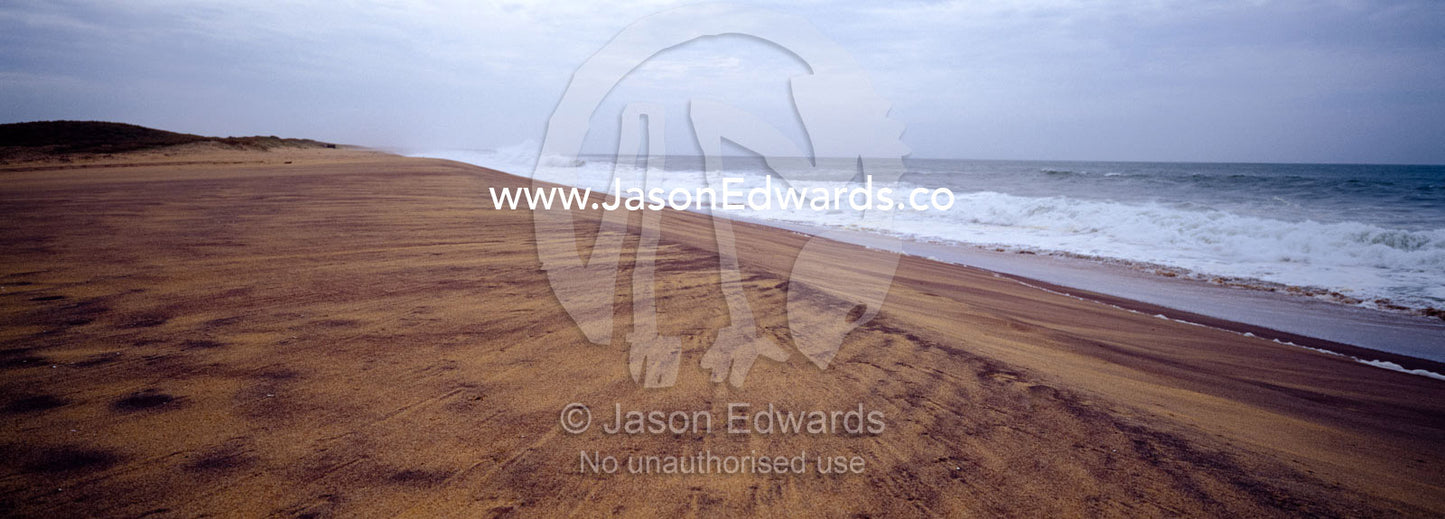 A storm marches along a remote beach on Sri Lanka's southern coast. Bundala National Park, Sri Lanka.