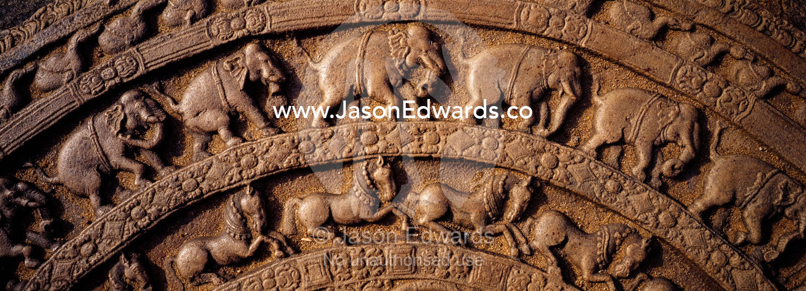 Ancient carvings in Moonstones often depict Elephants and horses. Polonnaruwa Ancient City,  Sri Lanka.