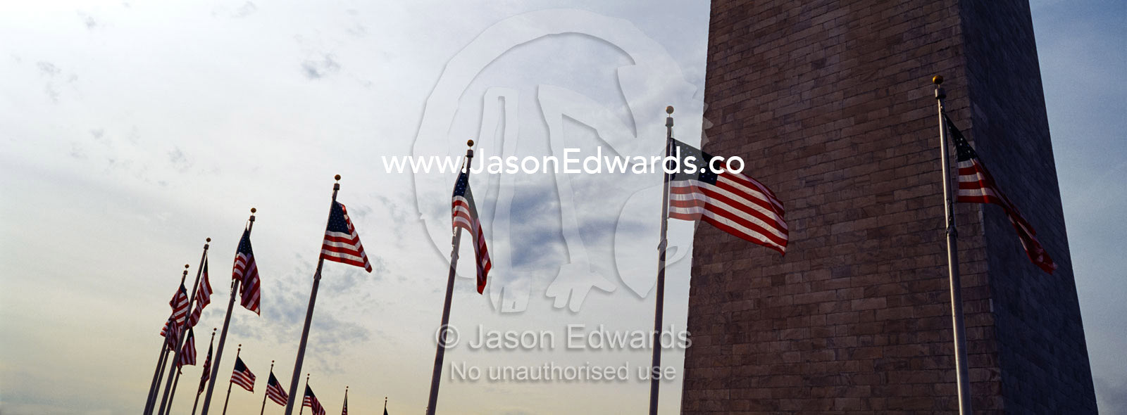 The American flag, Old Glory, flies near the Washington Monument. Washington DC, USA, United States of America.