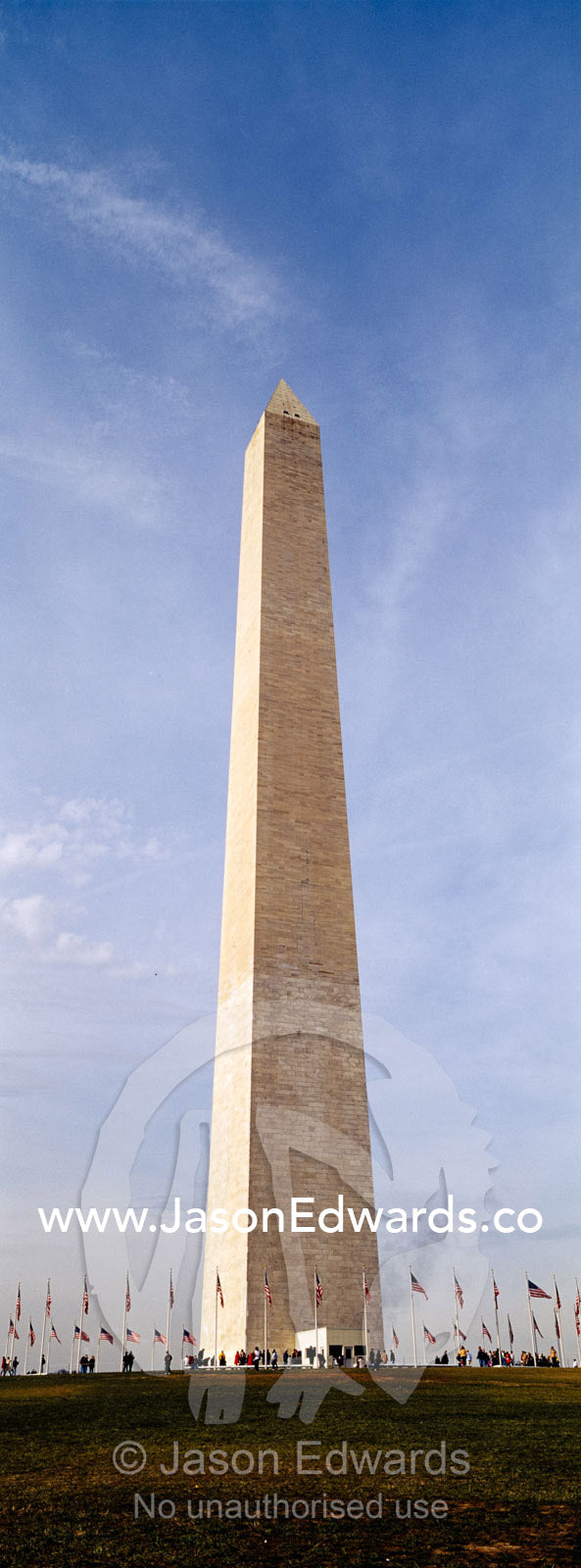The American flag, Old Glory, flies near the Washington Monument. Washington DC, USA, United States of America.