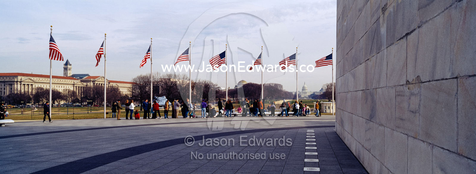 The American flag, Old Glory, flies near the Washington Monument. Washington DC, USA, United States of America.