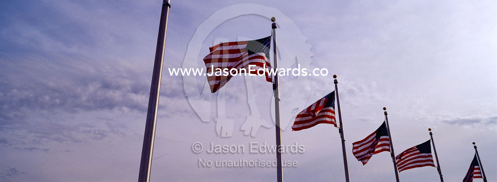 The American flag, Old Glory, flies near the Washington Monument. Washington DC, USA, United States of America.