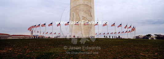 The American flag, Old Glory, flies near the Washington Monument. Washington DC, USA, United States of America.