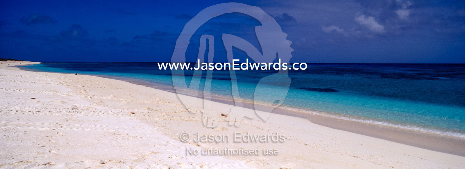The white sands of a deserted tropical island and warm turquoise seas. East Diamond Island, Coral Sea Island Territory, Australia.