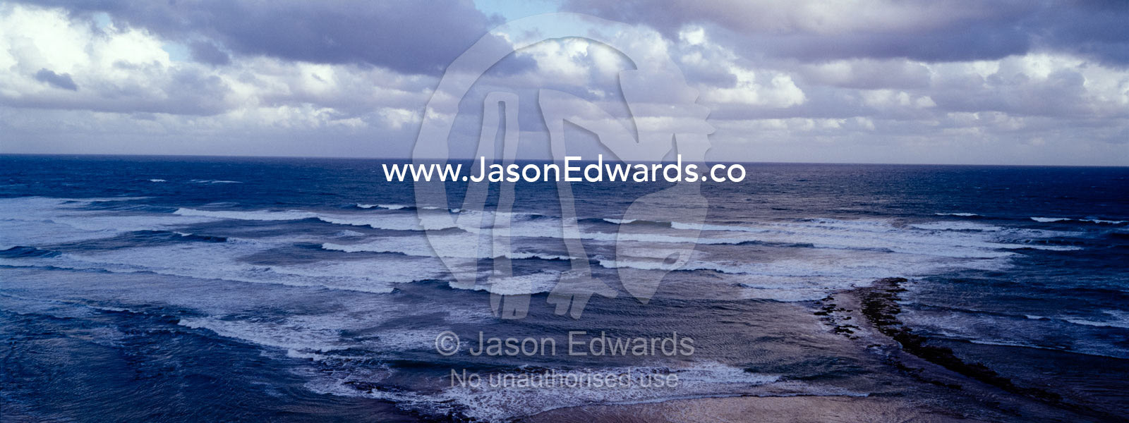 Strong winds pushing storm clouds and waves toward the coast. Jan Juc, Victoria, Australia.