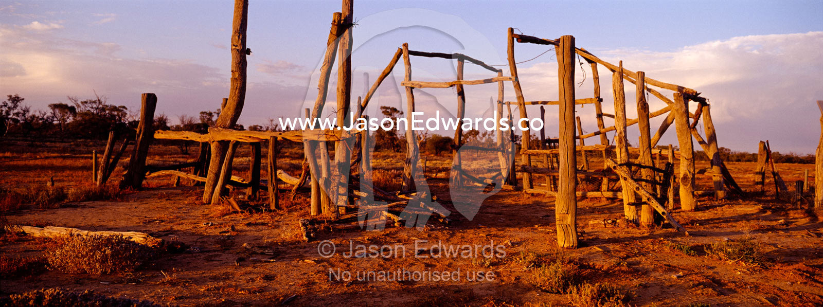 Sunset over antique cattle station homestead ruins in the desert. Sturt National Park, New South Wales, Australia.