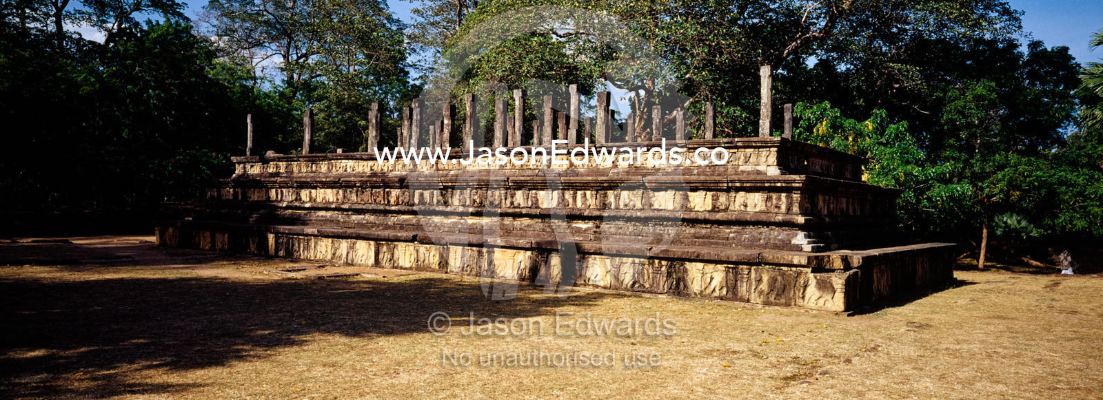 Audience Hall ruins with a frieze of carved elephants at Polonnaruwa. Polonnaruwa Ancient City, Sri Lanka.