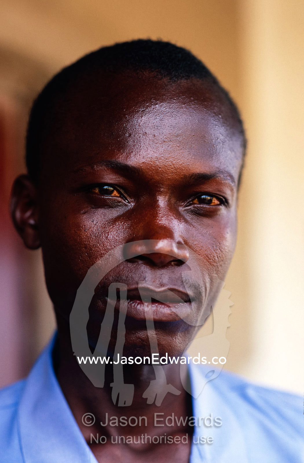 A portrait of a young African man looking to the future. Tororo District, Uganda.