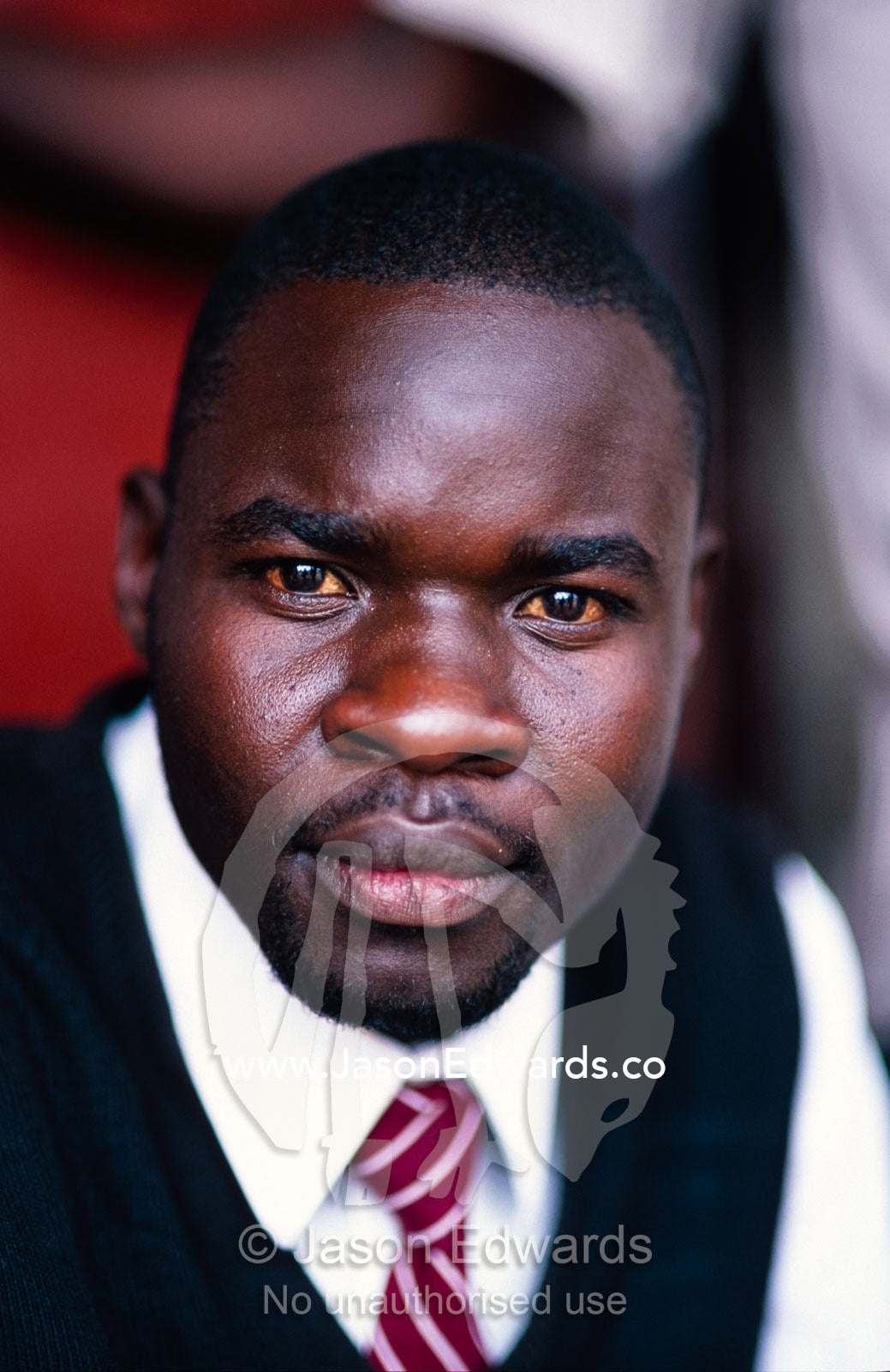 A portrait of a young East African businessman looking to succeed. Tororo District, Uganda.