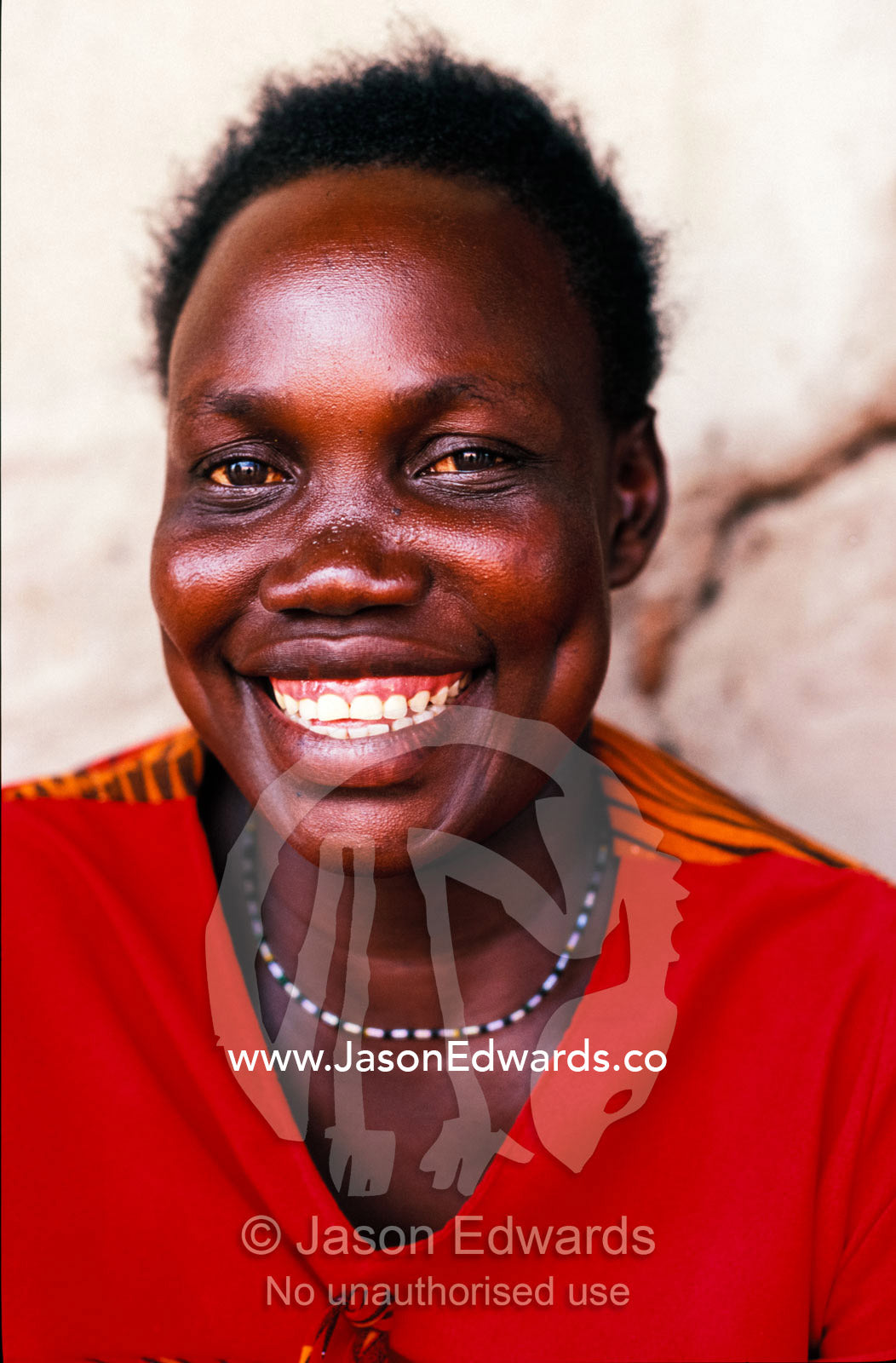 The smiling friendly face of a young East African woman. Tororo District, Uganda.
