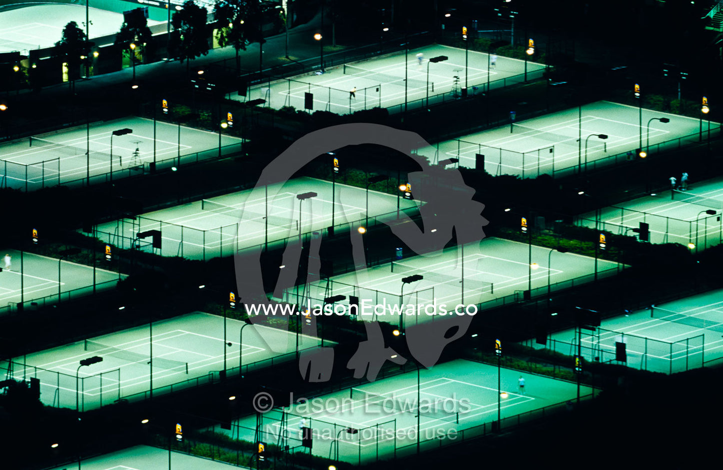 Rod Laver Arena tennis complex and courts illuminated at night. Melbourne, Victoria, Australia.