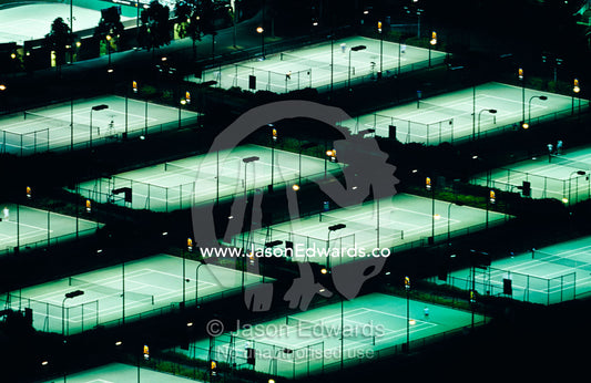 Rod Laver Arena tennis complex and courts illuminated at night. Melbourne, Victoria, Australia.