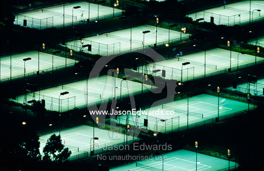 Rod Laver Arena tennis complex and courts illuminated at night. Melbourne, Victoria, Australia.