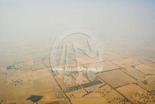 Smoke from vast bushfires shrouds farmland during a blistering summer. near Bendigo, Victoria, Australia.