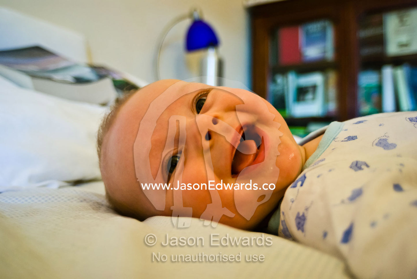 A joyous six month old infant displays a toothless smile. North Carlton, Victoria, Australia.