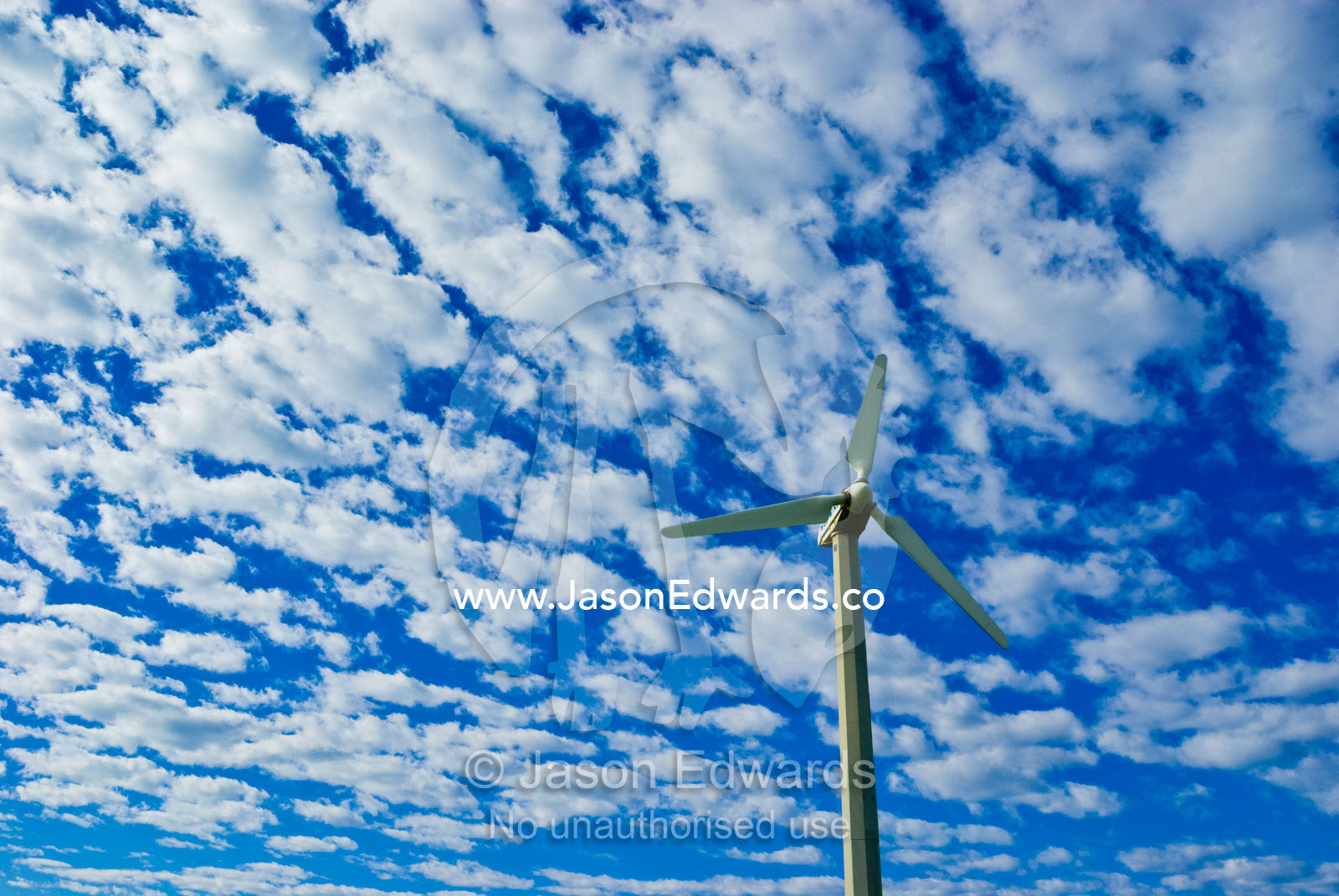 A coastal wind turbine provides electricity for a research station. near Breamlea, Victoria, Australia.