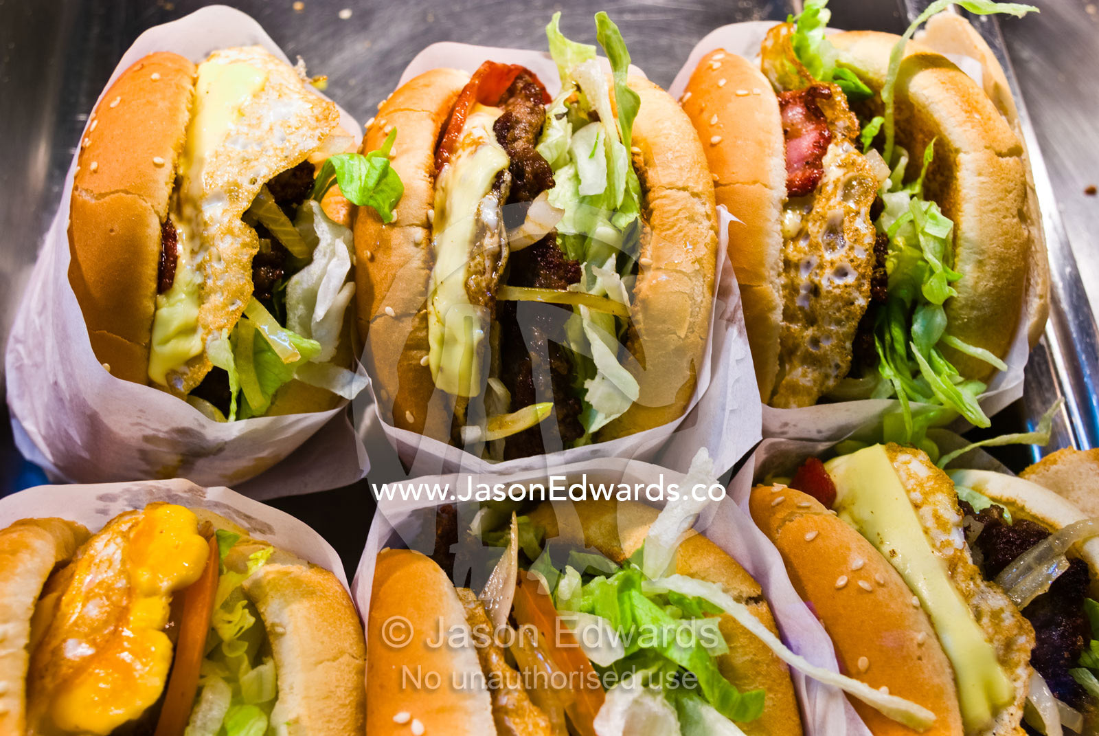 Freshly made hamburgers and salad on display in a fast food restuarant Geelong, Victoria, Australia.