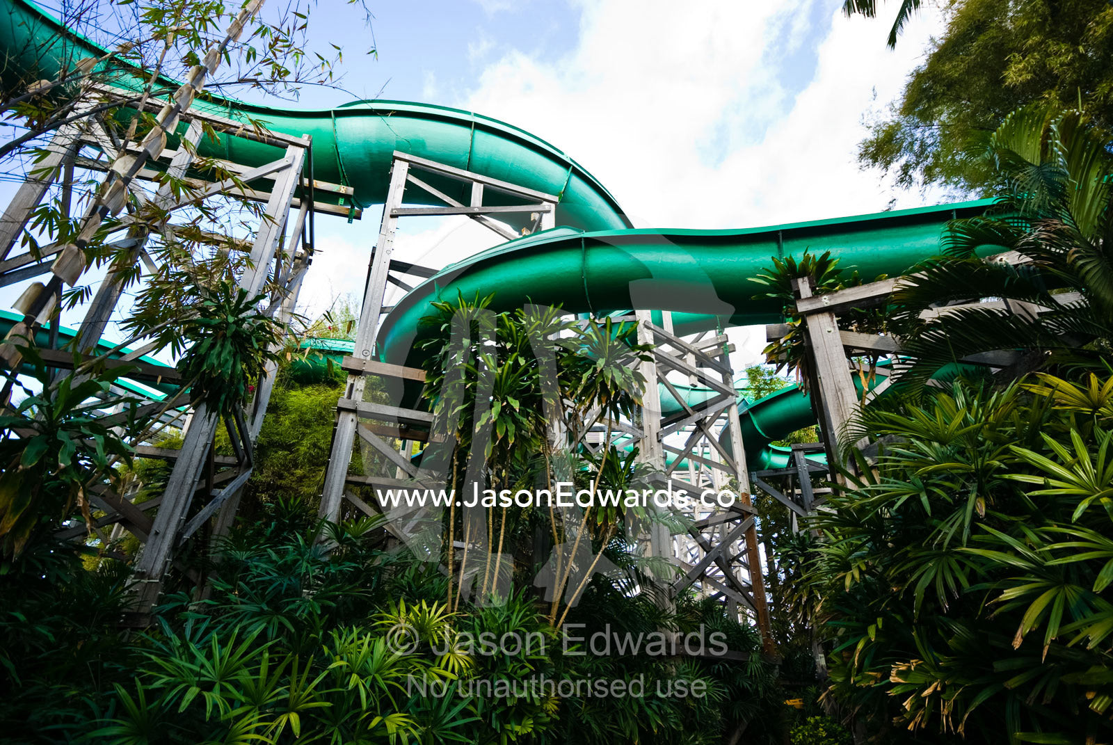 Giant water slides twist and turn through a tourist theme park. Waterbom Park, Tuban, Bali, Indonesia.