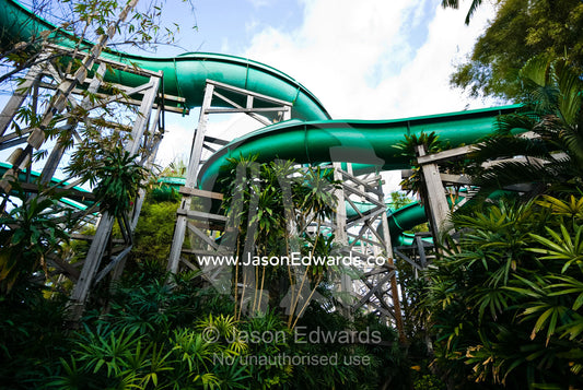 Giant water slides twist and turn through a tourist theme park. Waterbom Park, Tuban, Bali, Indonesia.