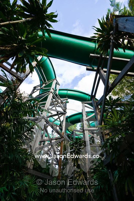 Giant water slides twist and turn through a tourist theme park. Waterbom Park, Tuban, Bali, Indonesia.