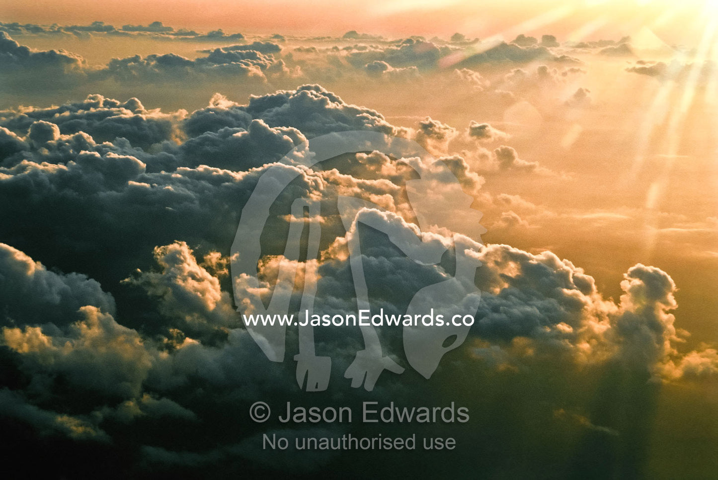 Sunset touches the edge of a tropical storm front over Tanzania. Western Tanzania.