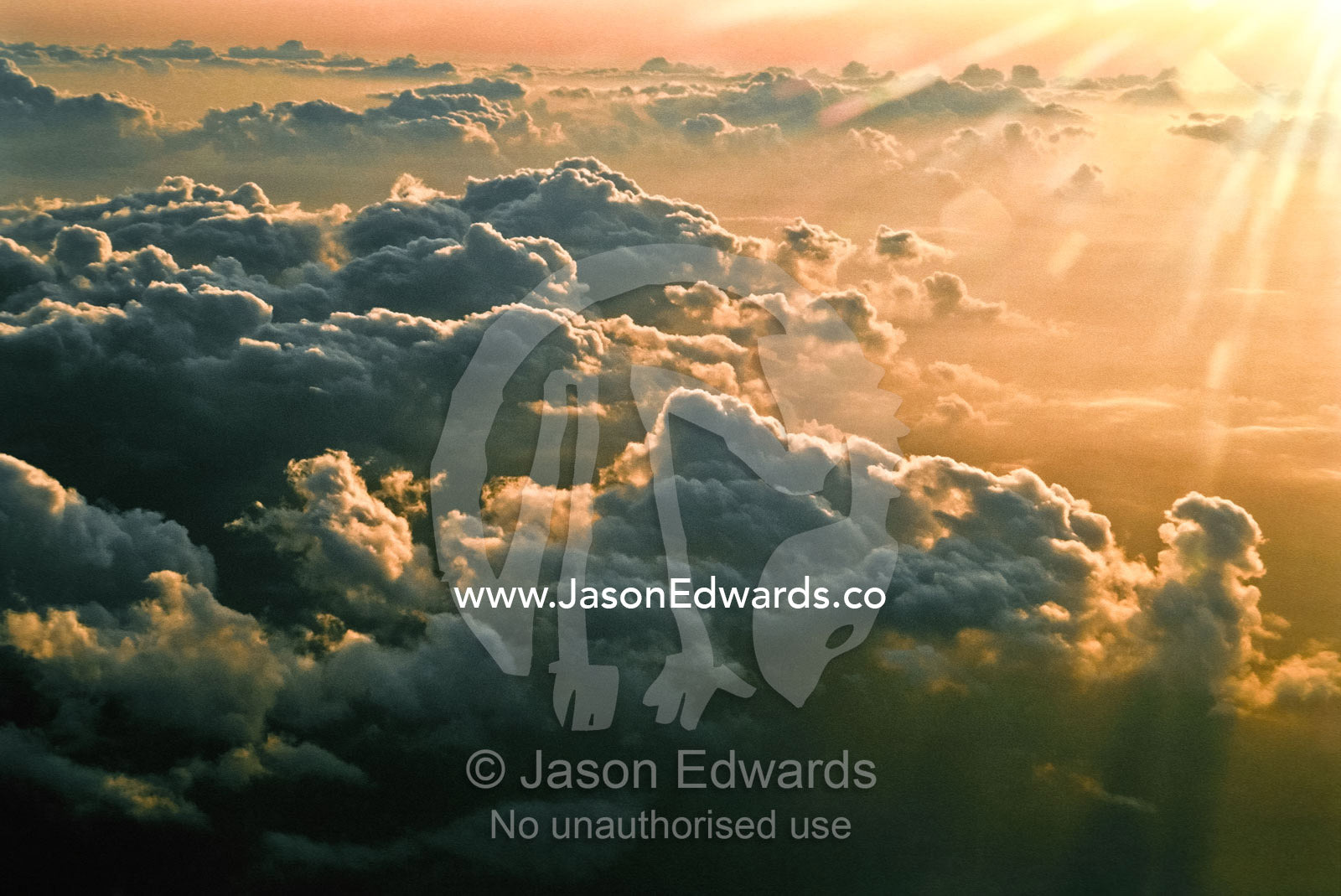 Sunset touches the edge of a tropical storm front over Tanzania. Western Tanzania.