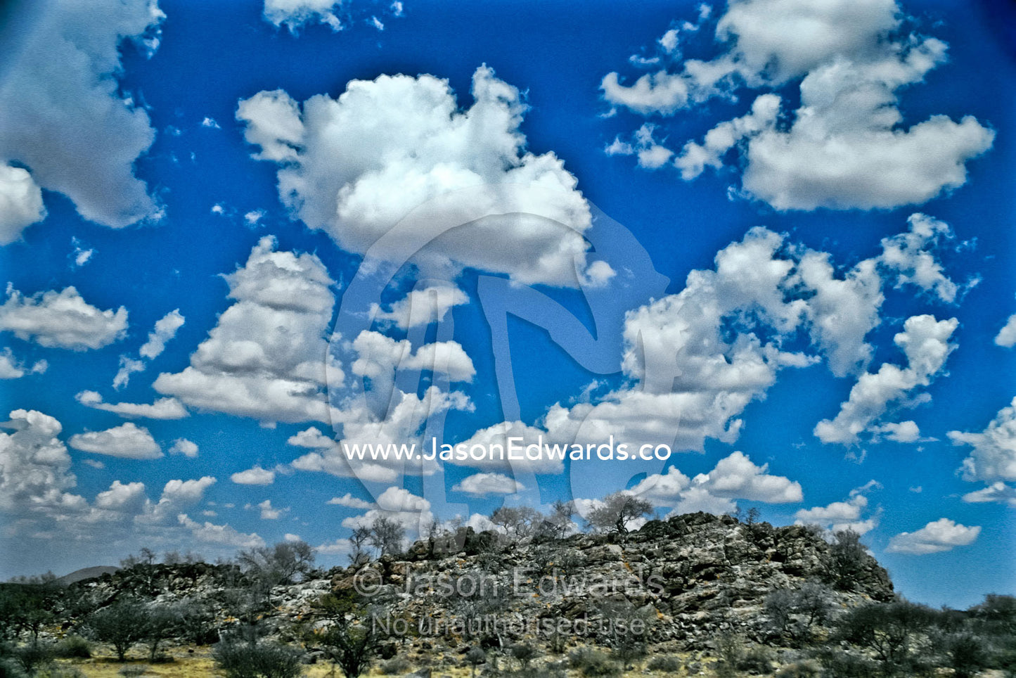 The Khomas Hochland with its rolling hills of schist below a blue sky. Khomas Hochland, near Windhoek, Namibia.