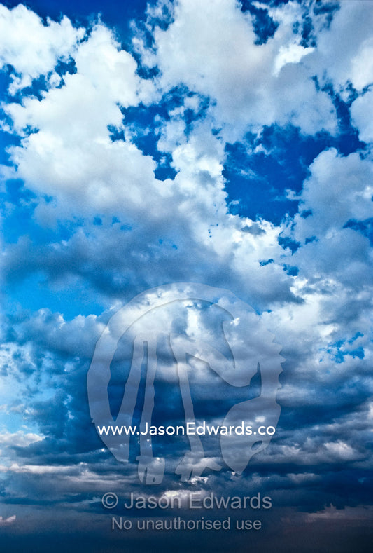 Billowing dry season storm clouds roil over the open savannah. Etosha National Park, Namibia.