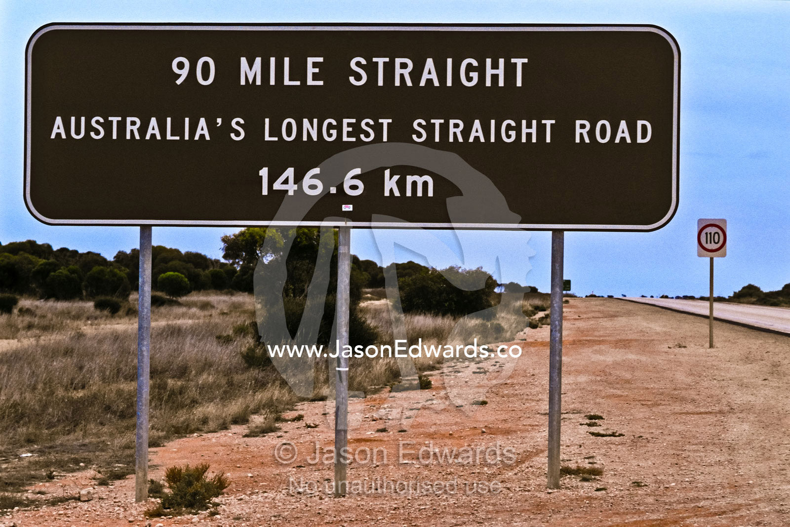A roadside sign on the Nullarbor Plain indicates a straight road ahead Nullarbor Plain, Western Australia, Australia.