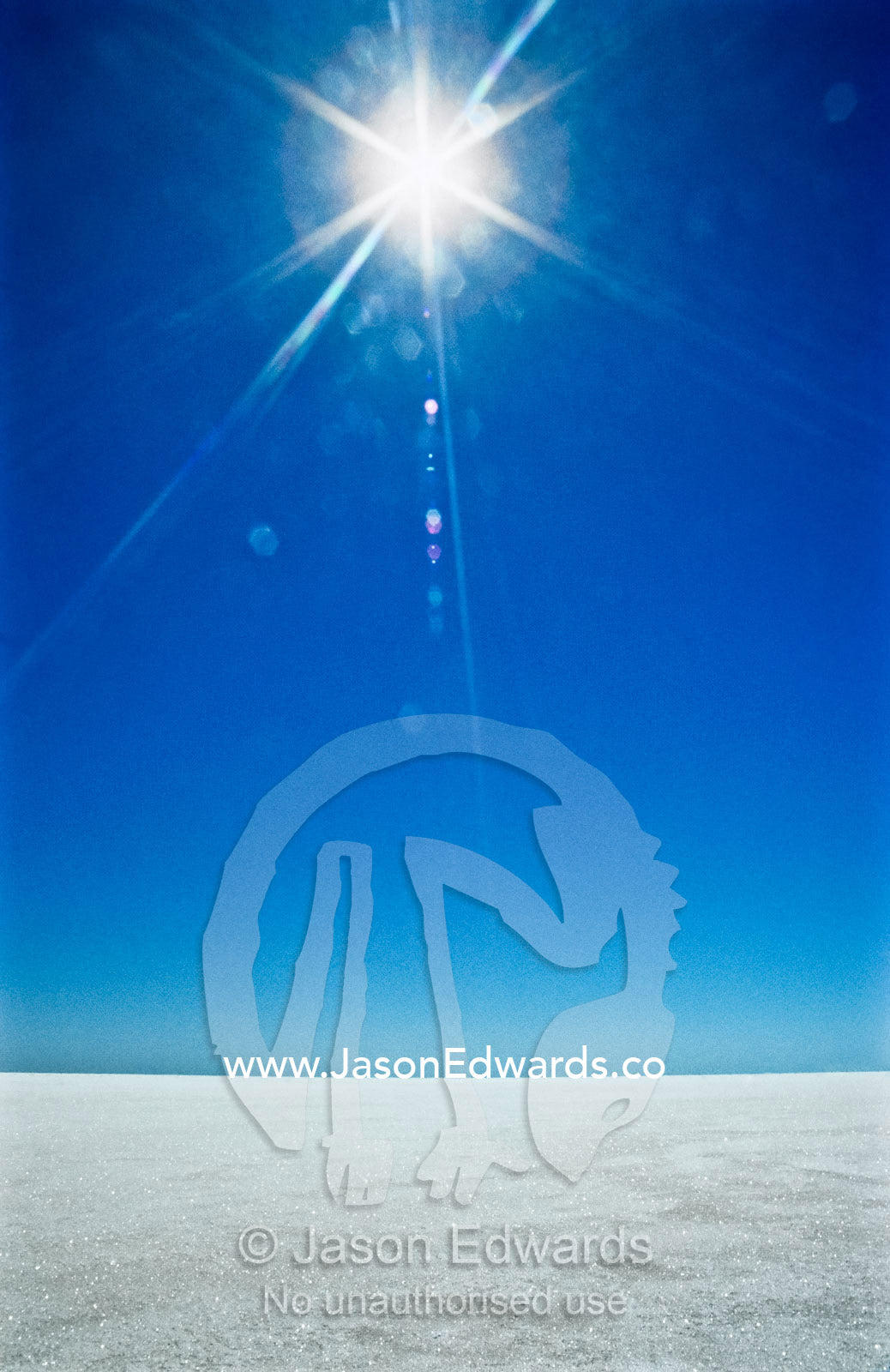 A blistering sun beats down on the white salt surface of Lake Eyre. Lake Eyre South National Park, South Australia, Australia.