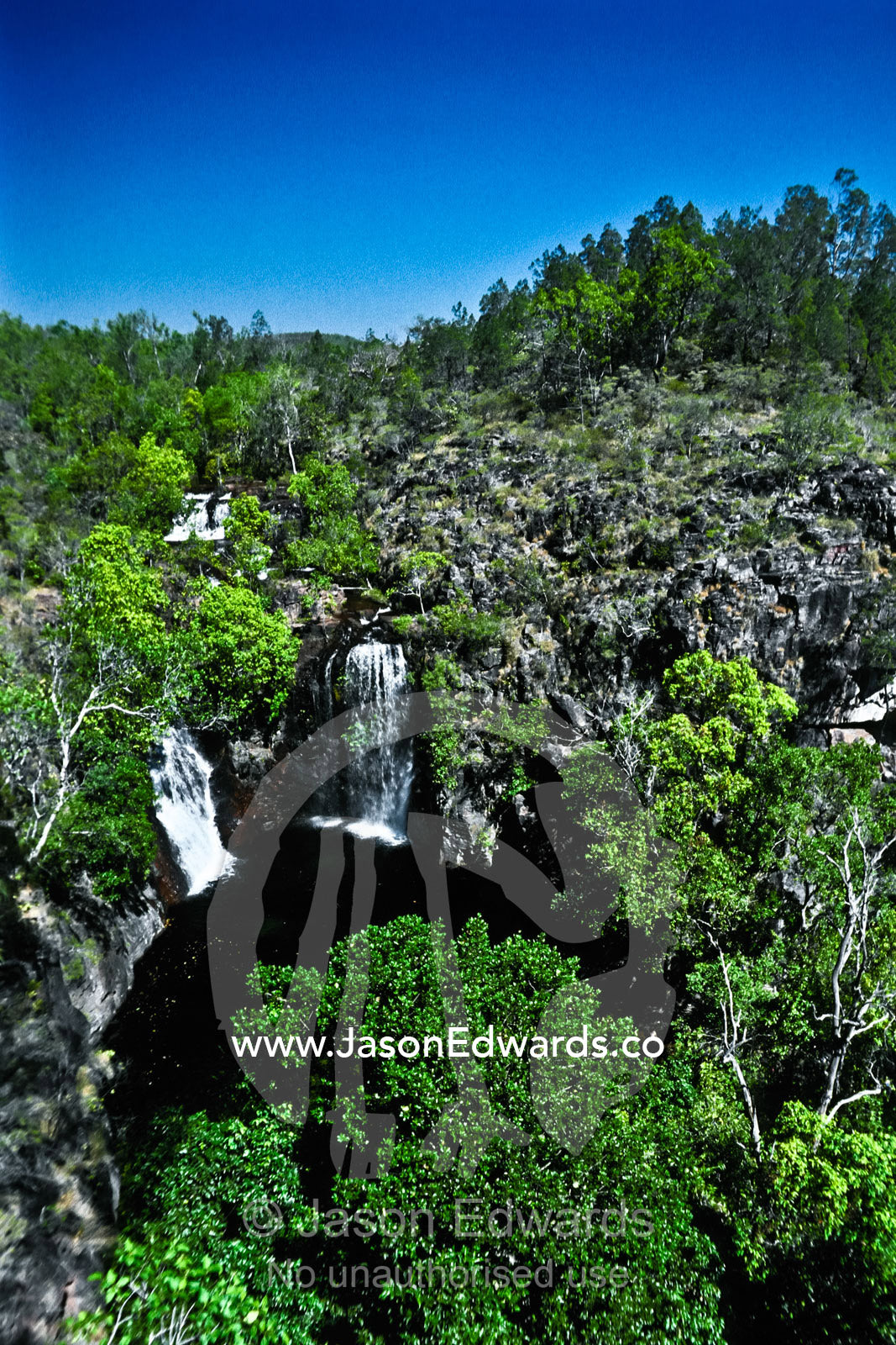 Florence Falls is a double waterfall surrounded by tropical rainforest Litchfield National Park, Northern Territory, Australia.