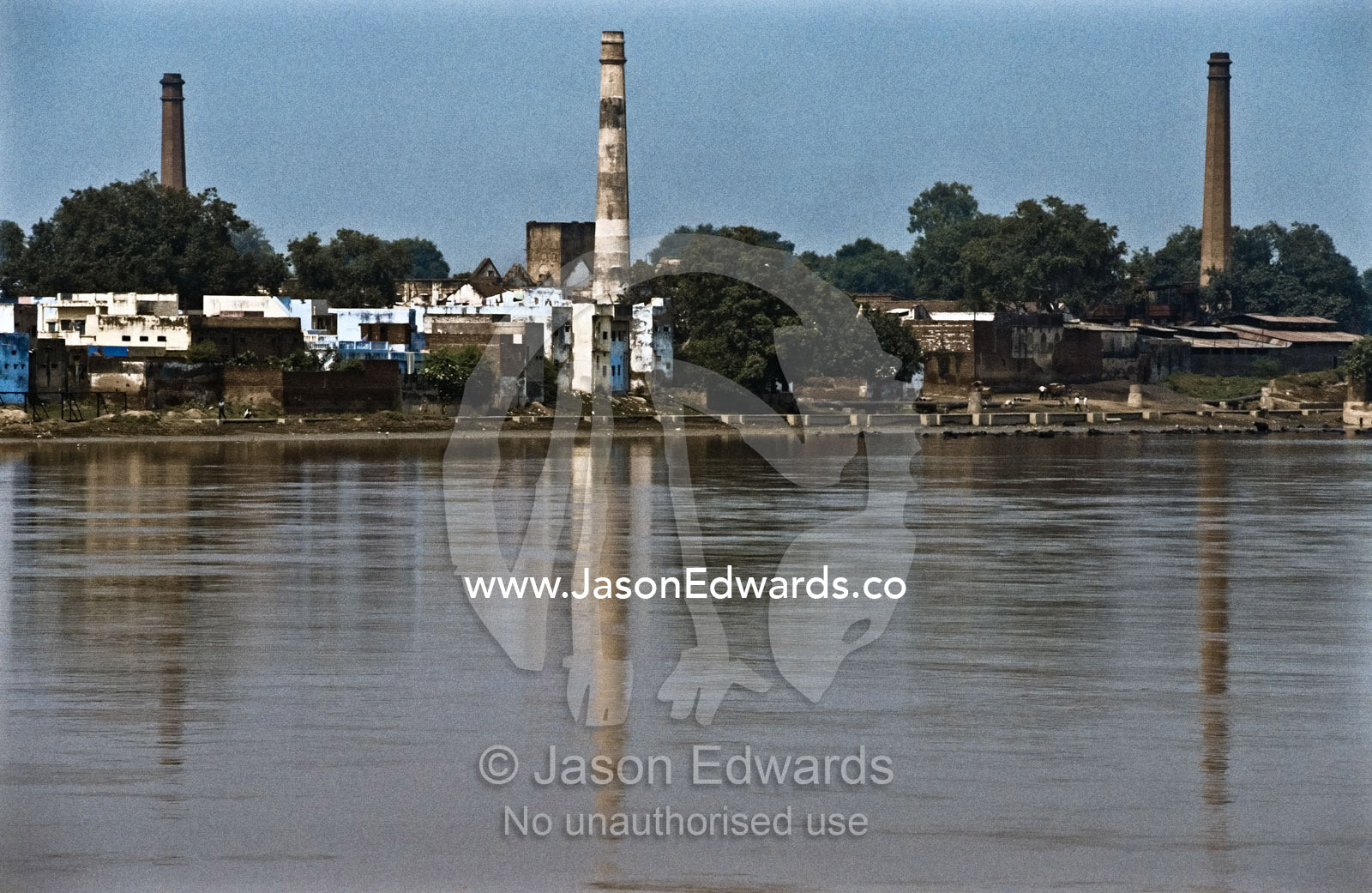 Factory pollution on the Yamuna River a major tributary of the Ganges. Yamuna River, Agra, India.
