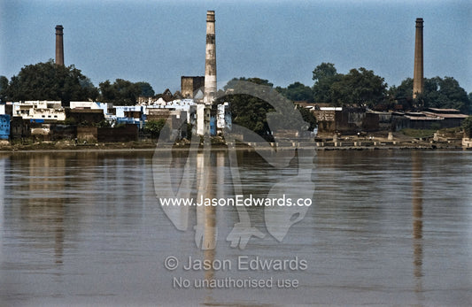 Factory pollution on the Yamuna River a major tributary of the Ganges. Yamuna River, Agra, India.