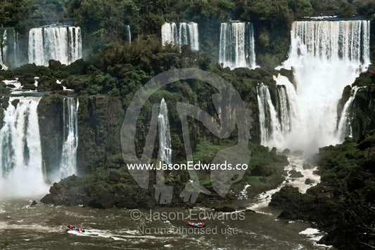The Iguazo River plummets through steaming subtropical rainforest. Iguazo Falls, Iguazu National Park, Argentina.