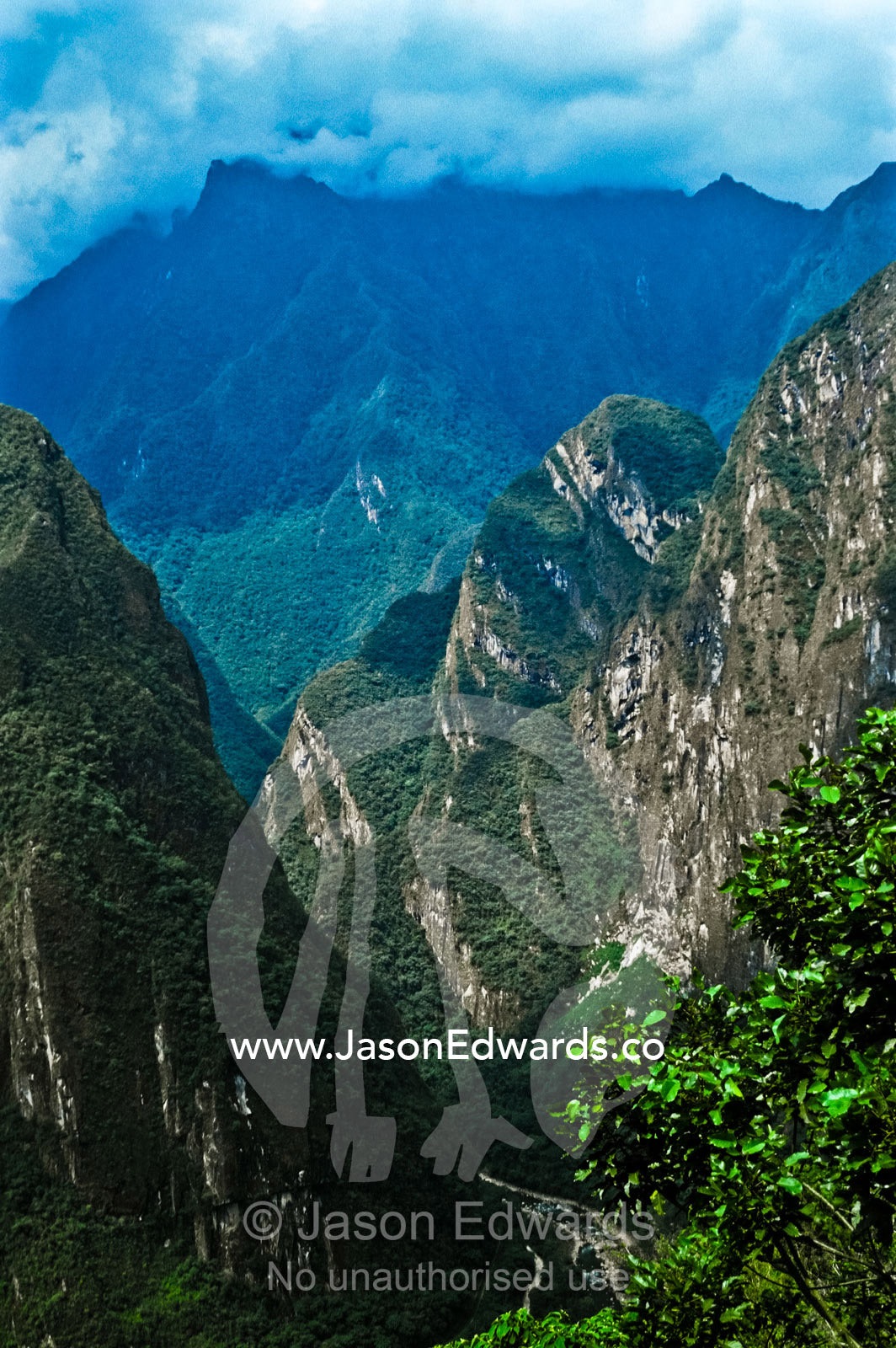 The Urubamba River flows through a sheer valley shrouded in rainforest Urubamba Valley, Peru.
