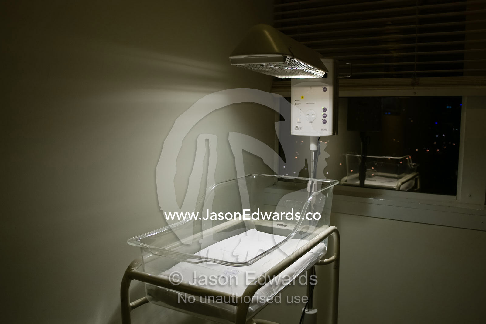 An infant warmer complete with name tags awaits the arrival of a baby. Frances Perry House, Carlton, Victoria, Australia.