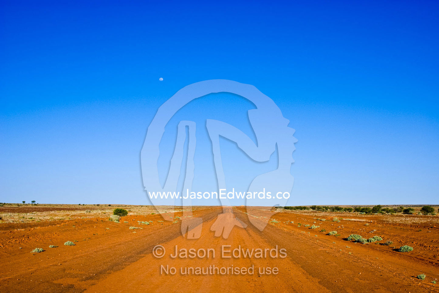 One of many Australian highways that are unsealed red desert tracks. Silver City Highway, south of Tibooburra, New South Wales, Australia.