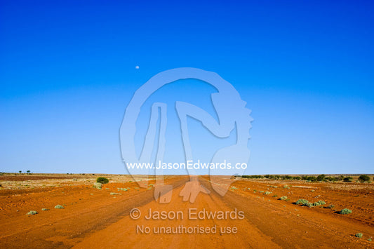 One of many Australian highways that are unsealed red desert tracks. Silver City Highway, south of Tibooburra, New South Wales, Australia.