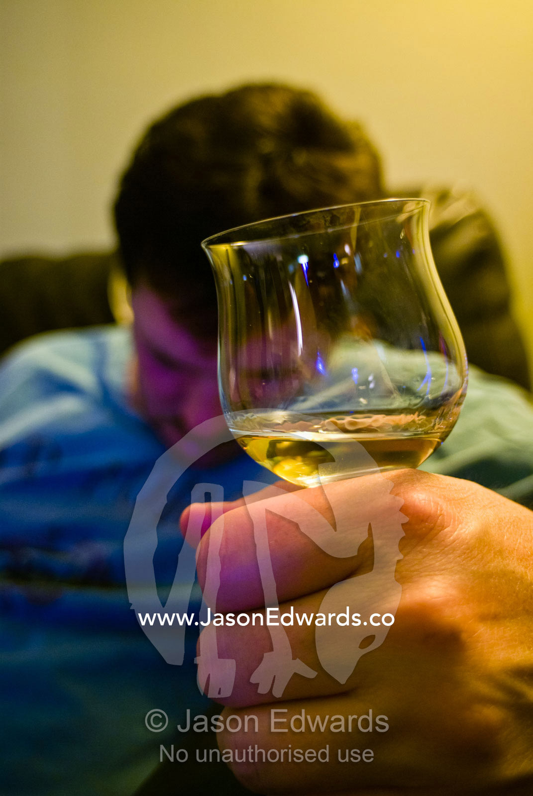A man falls asleep after consuming large quantities of alcohol. Herndon, Virginia.
