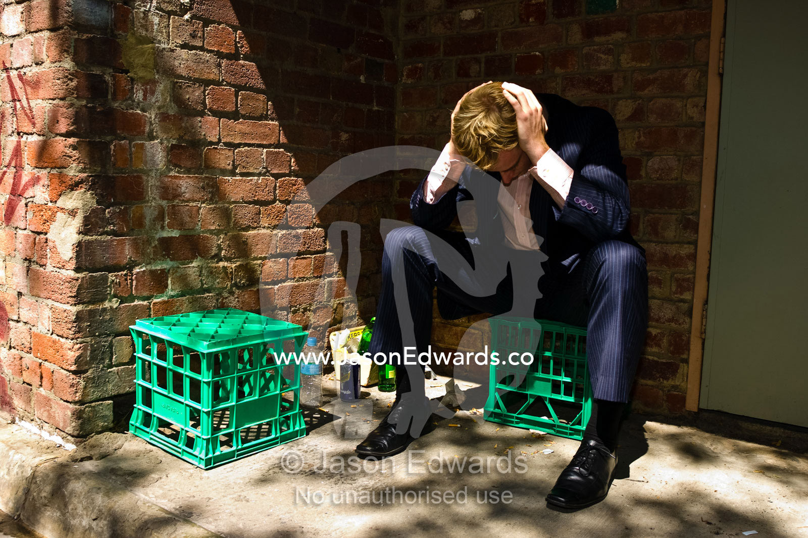 A businessman struggles to come to grips with the failing economy. Melbourne, Victoria, Australia.