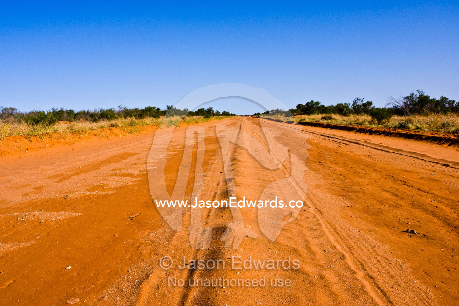 One of many Australian highways that are unsealed red desert tracks. Silver City Highway, south of Tibooburra, New South Wales, Australia.