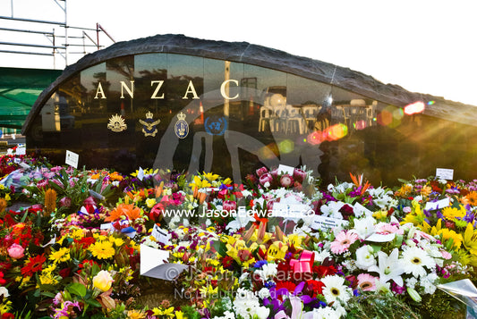 Flowers adorn a World War 1 memorial to the ANZACs. Point Danger, Torquay, Victoria, Australia.