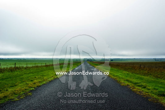 A cold winters day on a forlorn country road in the middle of nowhere. near Basalt, Daylesford District, Victoria, Australia.